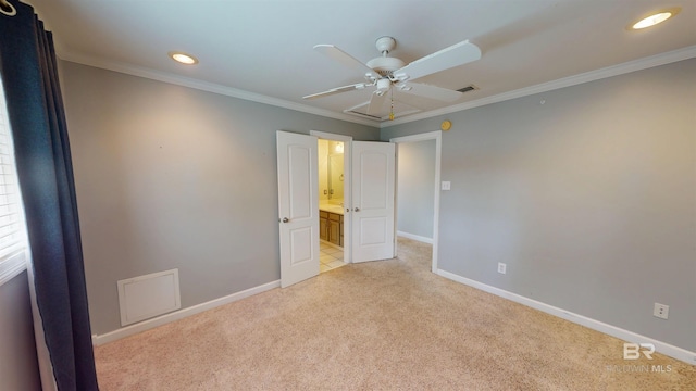 1651 Laurel St, Mobile, AL 36604 - unfurnished bedroom with light carpet, baseboards, crown molding, recessed lighting, and connected bathroom