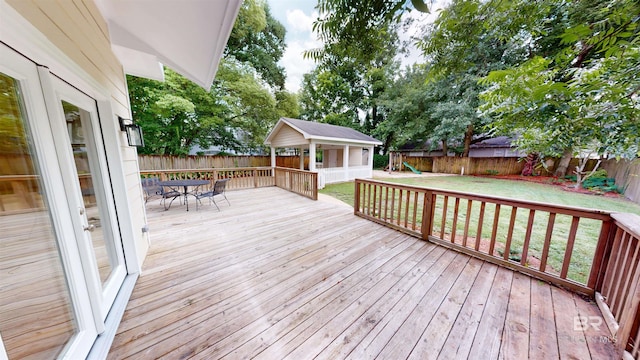 1651 Laurel St, Mobile, AL 36604 - deck featuring a playground and outdoor dining area