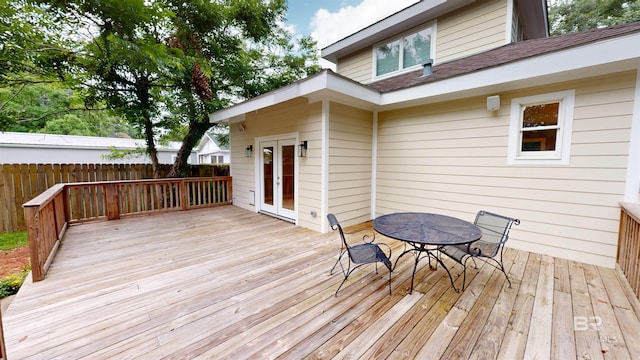 1651 Laurel St, Mobile, AL 36604 - wooden deck with outdoor dining space and french doors