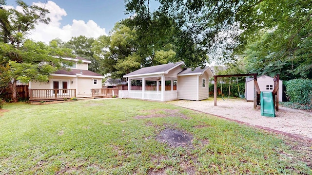 1651 Laurel St, Mobile, AL 36604 - view of yard featuring a playground, french doors, a deck, and a detached carport