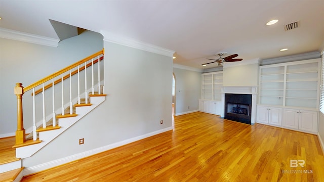1651 Laurel St, Mobile, AL 36604 - unfurnished living room featuring a ceiling fan, crown molding, baseboards, wood finished floors, and recessed lighting