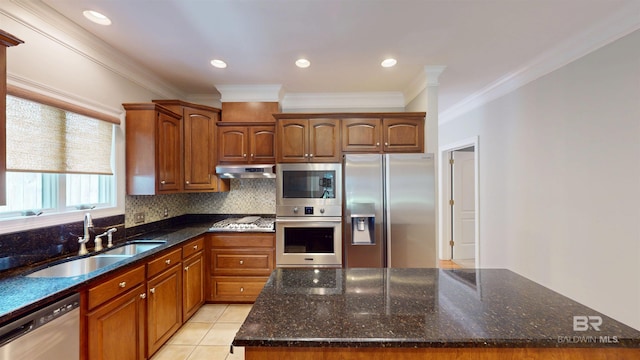 1651 Laurel St, Mobile, AL 36604 - kitchen with appliances with stainless steel finishes, a sink, crown molding, backsplash, and dark stone counters