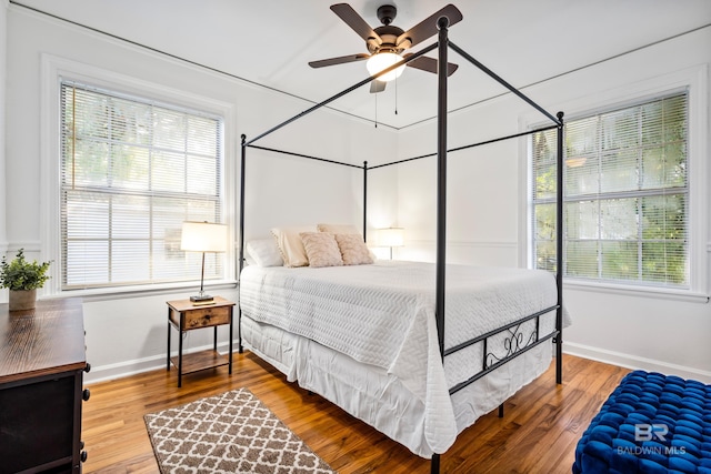 255 Pinehill Dr, Mobile, AL 36606 - bedroom with multiple windows, baseboards, and wood finished floors