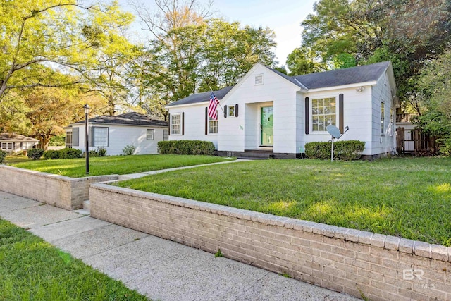 255 Pinehill Dr, Mobile, AL 36606 - view of front of house featuring a front lawn and a shingled roof