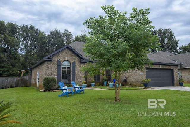 20752 Southwood St, Fairhope, AL 36532 - view of front of house featuring driveway, a garage, brick siding, and a shingled roof