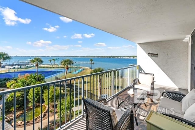 balcony featuring a water view