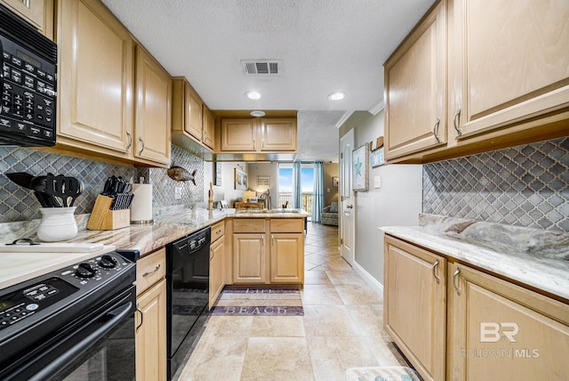 kitchen featuring kitchen peninsula, light brown cabinets, backsplash, and black appliances