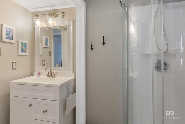 bathroom with a stall shower and vanity