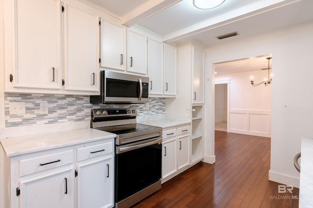 kitchen featuring dark hardwood / wood-style flooring, white cabinetry, decorative backsplash, and stainless steel appliances