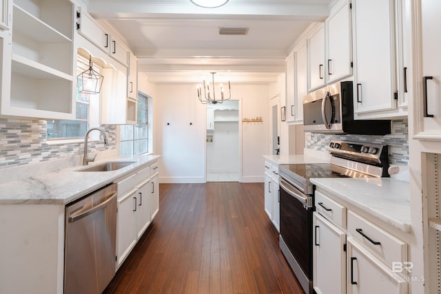 kitchen with stainless steel appliances and white cabinetry