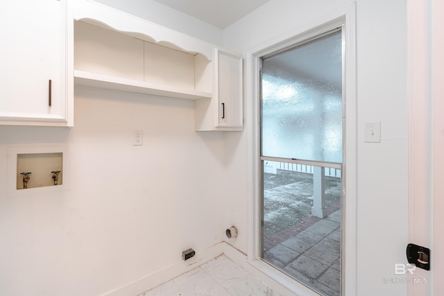 clothes washing area featuring cabinets and hookup for a washing machine