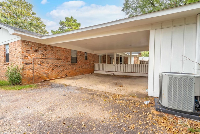 exterior space featuring cooling unit and a carport