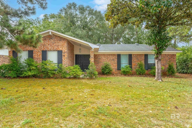 ranch-style home featuring a front yard