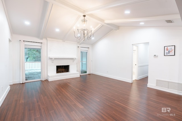 unfurnished living room with a brick fireplace, lofted ceiling with beams, dark hardwood / wood-style floors, and a chandelier