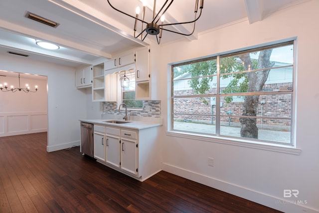 kitchen with tasteful backsplash, white cabinetry, a notable chandelier, dark hardwood / wood-style floors, and stainless steel dishwasher