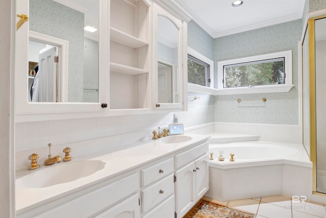 bathroom with vanity, a tub to relax in, crown molding, and tile patterned floors