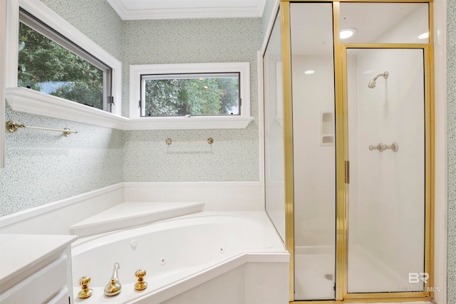 bathroom featuring vanity, ornamental molding, plus walk in shower, and a healthy amount of sunlight