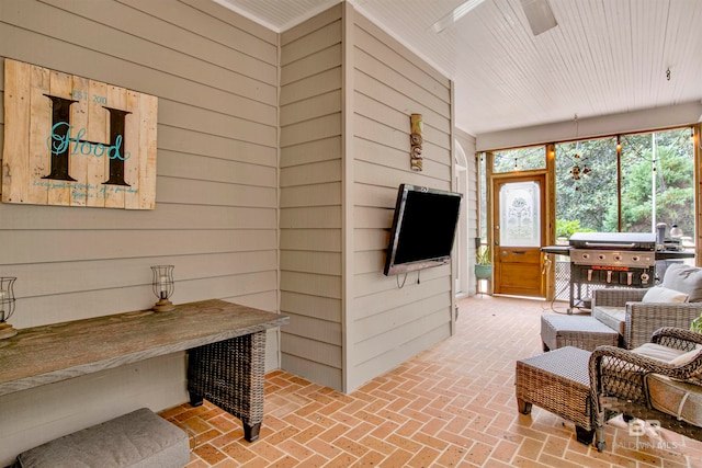 living room featuring wood walls