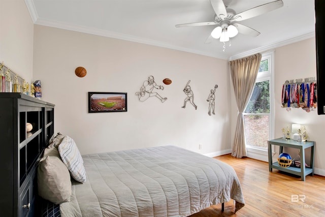 bedroom with ceiling fan, wood-type flooring, and ornamental molding