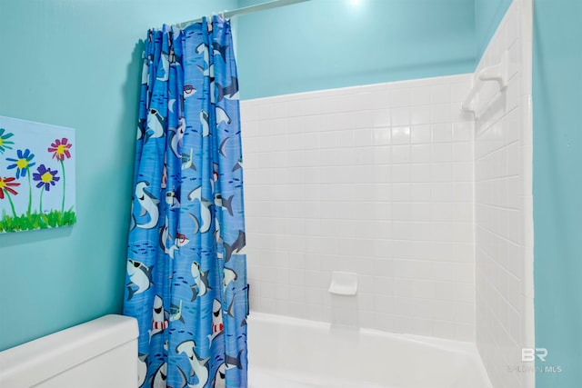 bathroom featuring toilet and shower / bathtub combination with curtain