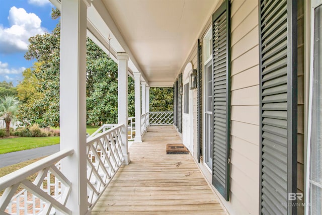 wooden terrace with a porch