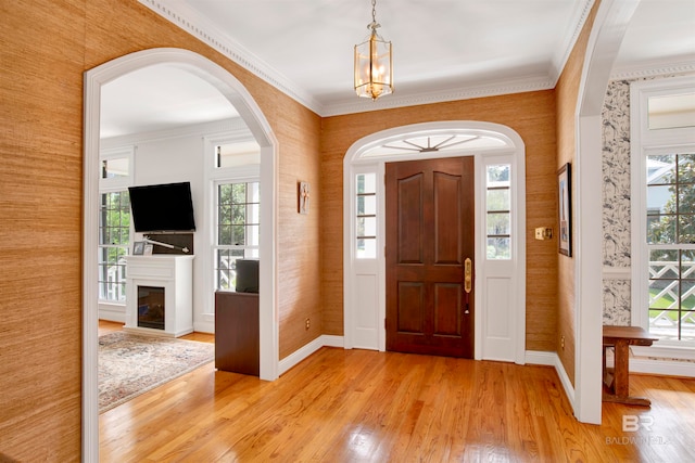 entryway with a healthy amount of sunlight and light hardwood / wood-style floors