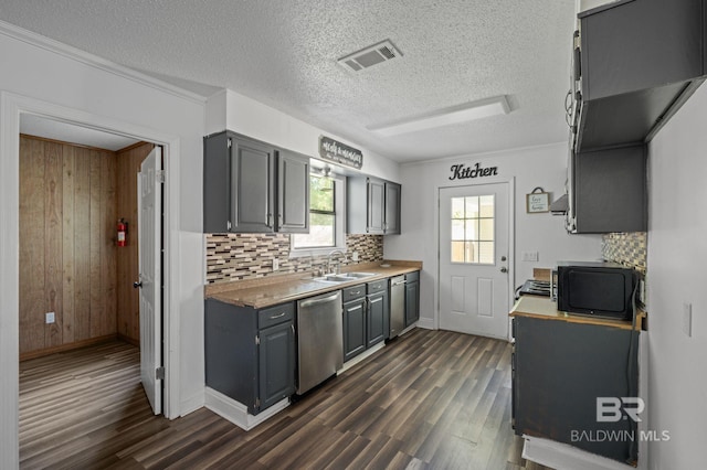 302 Norwood Ct, Bay Minette, AL 36507 - kitchen featuring stainless steel dishwasher, a sink, gray cabinets, dark wood finished floors, and a textured ceiling