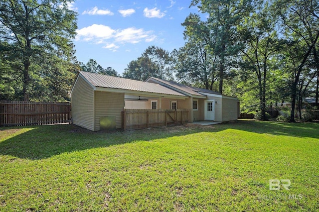 302 Norwood Ct, Bay Minette, AL 36507 - rear view of house with metal roof and ceiling fan