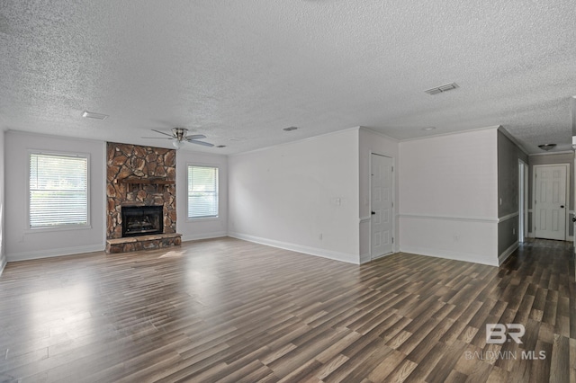 302 Norwood Ct, Bay Minette, AL 36507 - unfurnished living room with a ceiling fan, a textured ceiling, wood finished floors, a fireplace, and baseboards