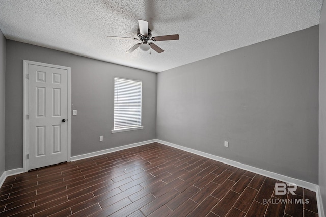302 Norwood Ct, Bay Minette, AL 36507 - spare room featuring a ceiling fan, a textured ceiling, dark wood finished floors, and baseboards