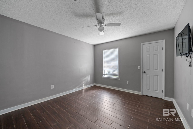 302 Norwood Ct, Bay Minette, AL 36507 - unfurnished room with a ceiling fan, a textured ceiling, dark wood finished floors, and baseboards
