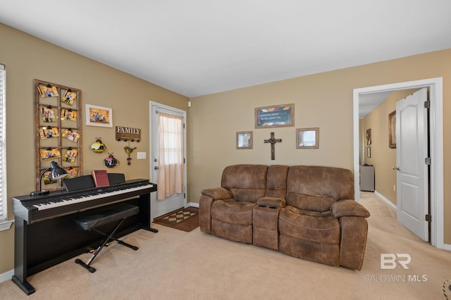 carpeted living room with baseboards