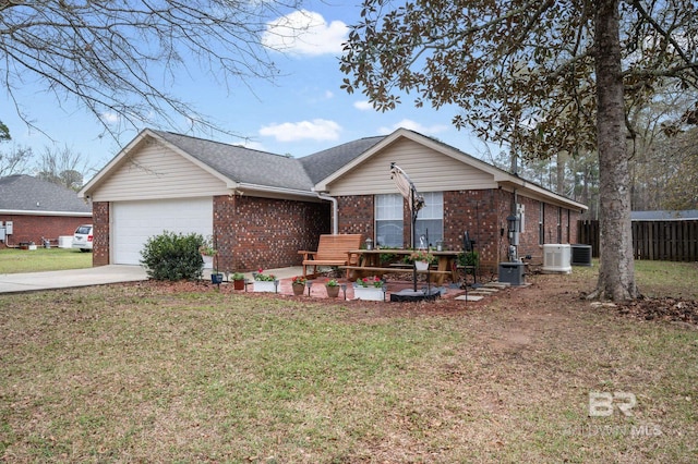 single story home featuring brick siding, concrete driveway, a front lawn, and a garage