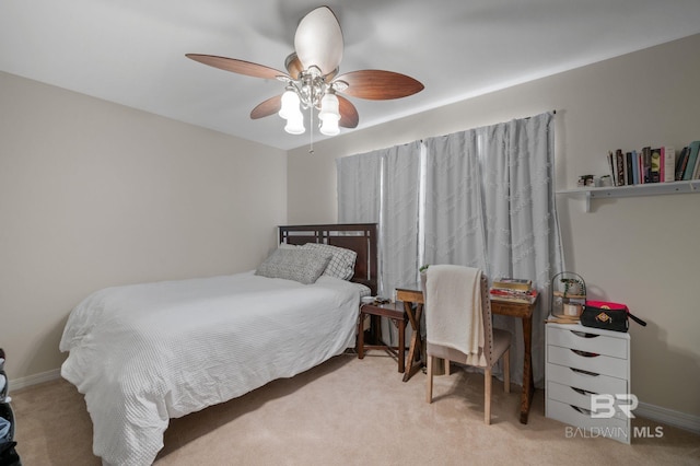 bedroom with baseboards, ceiling fan, and carpet flooring