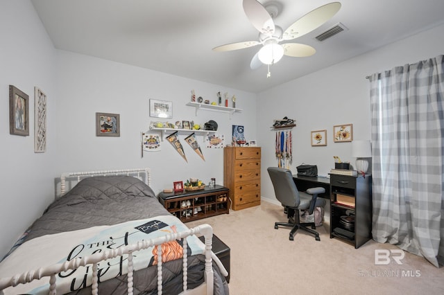 bedroom with light carpet, visible vents, and a ceiling fan