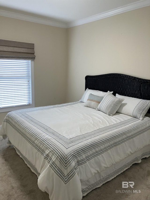 carpeted bedroom featuring ornamental molding