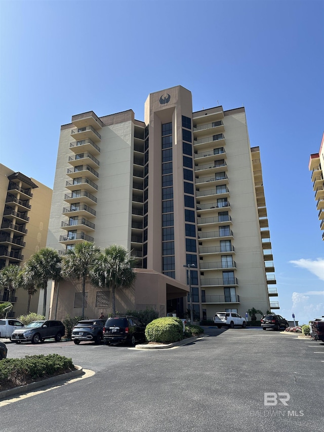 24250 Perdido Beach Blvd Unit 4603, Orange Beach, AL 36561 - view of apartment building / complex with uncovered parking