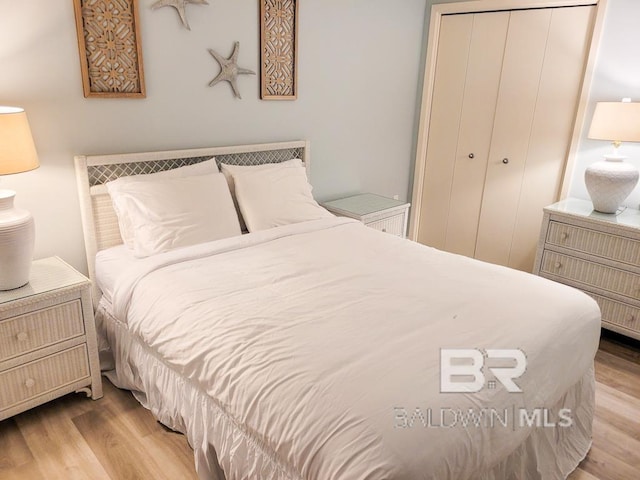 24250 Perdido Beach Blvd Unit 4603, Orange Beach, AL 36561 - bedroom with wood finished floors and a closet