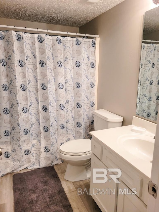 24250 Perdido Beach Blvd Unit 4603, Orange Beach, AL 36561 - full bath with wood finished floors, vanity, and a textured ceiling