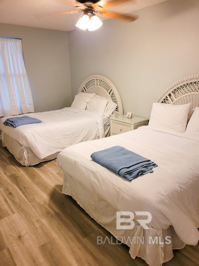 24250 Perdido Beach Blvd Unit 4603, Orange Beach, AL 36561 - bedroom with wood finished floors and a ceiling fan