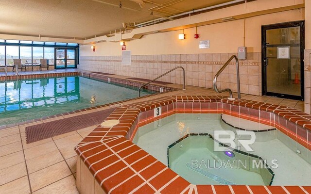 24250 Perdido Beach Blvd Unit 4603, Orange Beach, AL 36561 - indoor pool featuring a hot tub