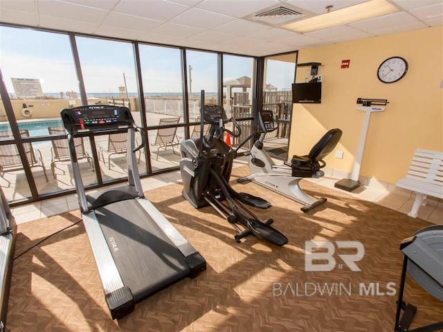 24250 Perdido Beach Blvd Unit 4603, Orange Beach, AL 36561 - workout area featuring a wall of windows and tile patterned flooring