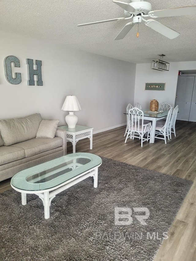 24250 Perdido Beach Blvd Unit 4603, Orange Beach, AL 36561 - living room featuring wood finished floors, ceiling fan, and a textured ceiling
