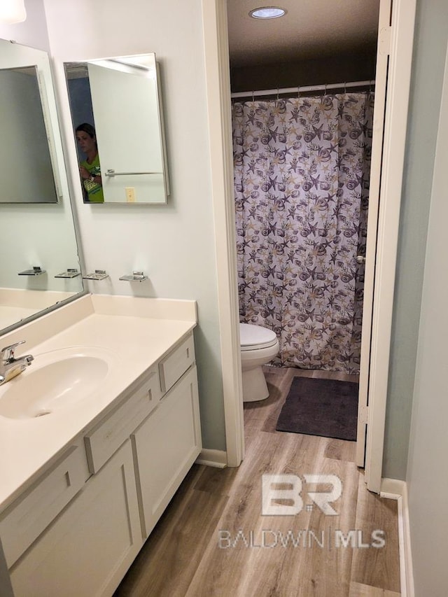 24250 Perdido Beach Blvd Unit 4603, Orange Beach, AL 36561 - bathroom featuring wood finished floors and vanity