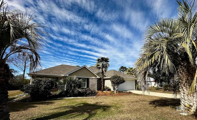 view of front of house with a front lawn and a garage