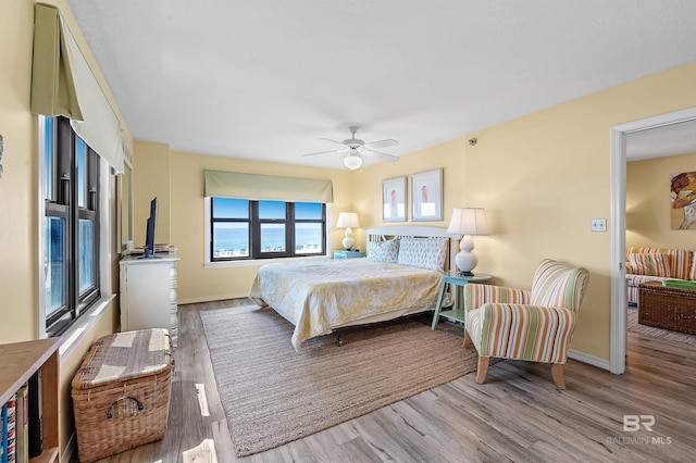 bedroom featuring ceiling fan and light wood-type flooring