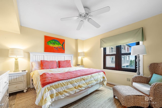 bedroom with ceiling fan and light wood-type flooring