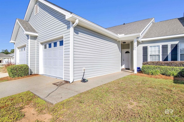 2651 S Juniper St Unit 1201, Foley, AL 36535 - view of front of house with an attached garage and a shingled roof