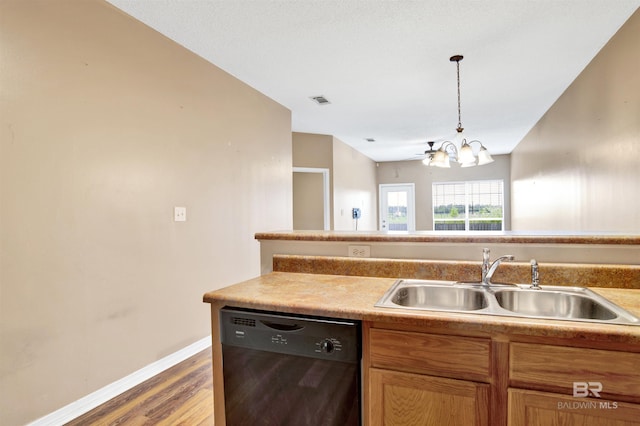2651 S Juniper St Unit 1201, Foley, AL 36535 - kitchen featuring dishwasher, a sink, wood finished floors, baseboards, and a chandelier