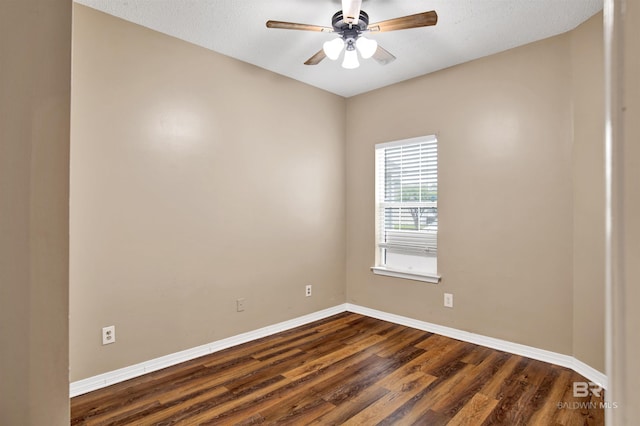 2651 S Juniper St Unit 1201, Foley, AL 36535 - spare room featuring dark wood finished floors, baseboards, and a ceiling fan